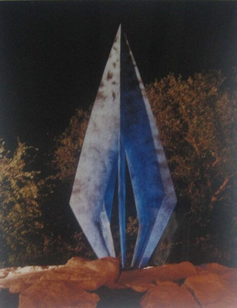 The British Gas Flame at Reading a large bronze sculpture lit with blue light from the bottom at night