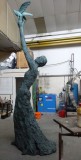 The finished bronze sculpture Speak to us of Freedom at the Foundry. She is facing left and we’re looking at her left side.