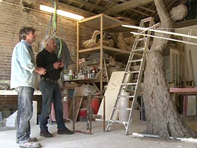 Neil and enlarger, Richard Clarke, looking at the newly enlarged version of Speak to us of Freedom in clay at just under 3.0m