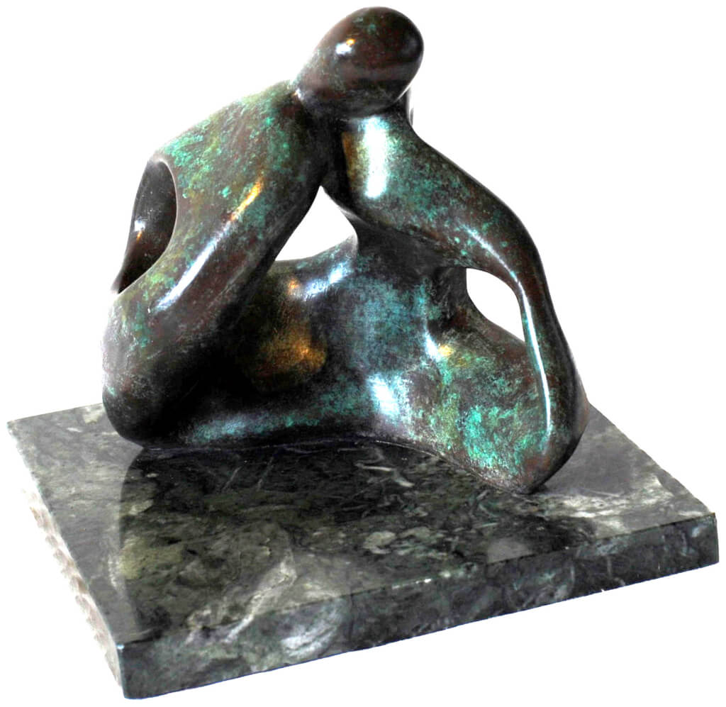 An abstract bronze sculpture of couple sitting on the ground kissing from the Gibran Sculpture Series. On marble plinth.