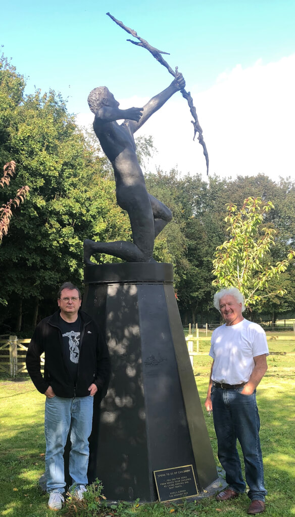 Andrew Cocks standing with Neil next to Neil's Speak to us of Children in the Ginran Sculpture Series